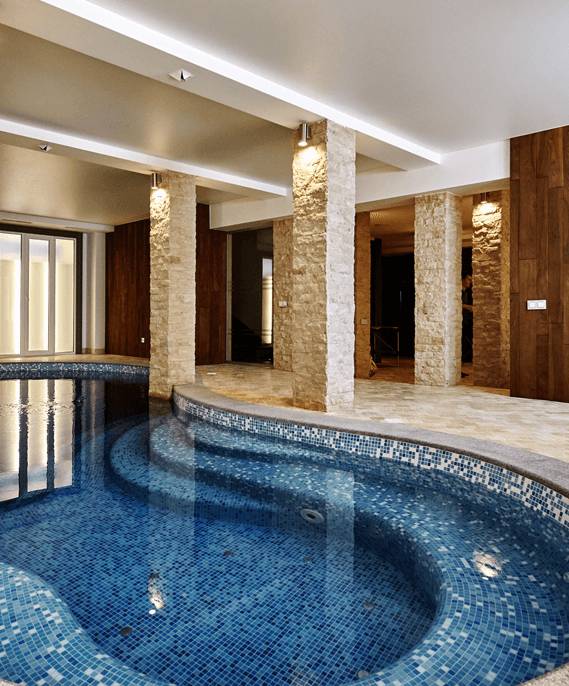 Indoor pool and spa with porcelain tile