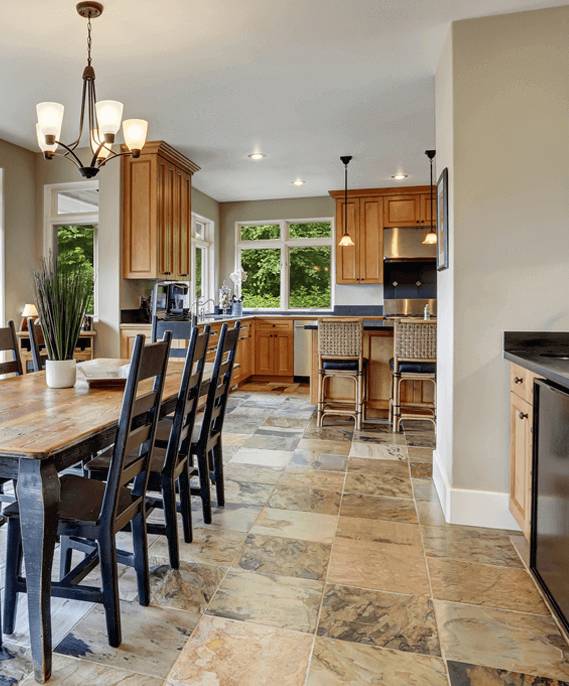 Modern kitchen with natural stone flooring