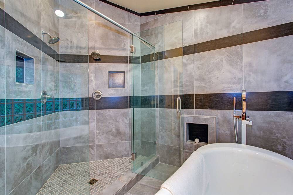 Walk in shower with tiles that look like marble